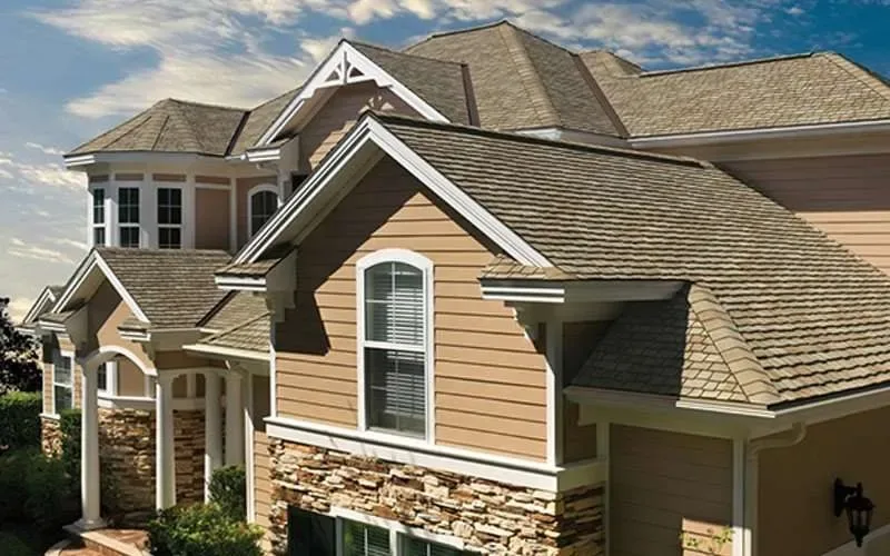 Completed asphalt shingle roof replacement on a two-story home